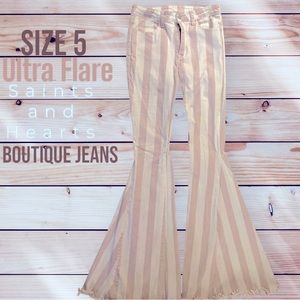 Size 5 “Saints and Hearts” ultra flare boutique jeans.